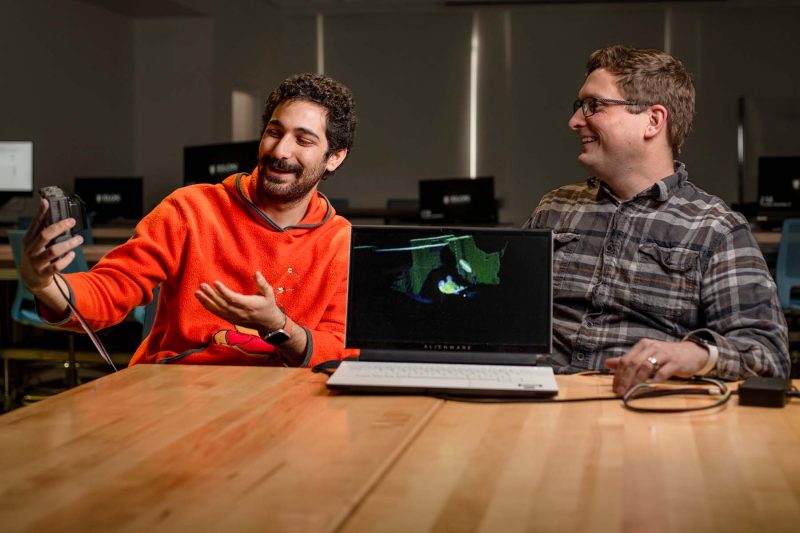 Associate Professor of Computer Science Ryan Mattfield and Rony Dahdal '26 demonstrate LiDAR technology.