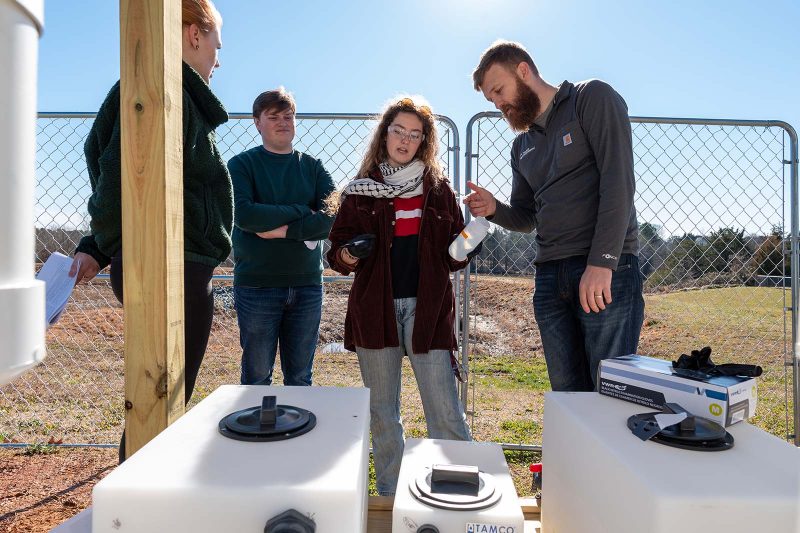 Lauren Hill ’24 testing the novel organic/inorganic composite materials with stormwater in the field