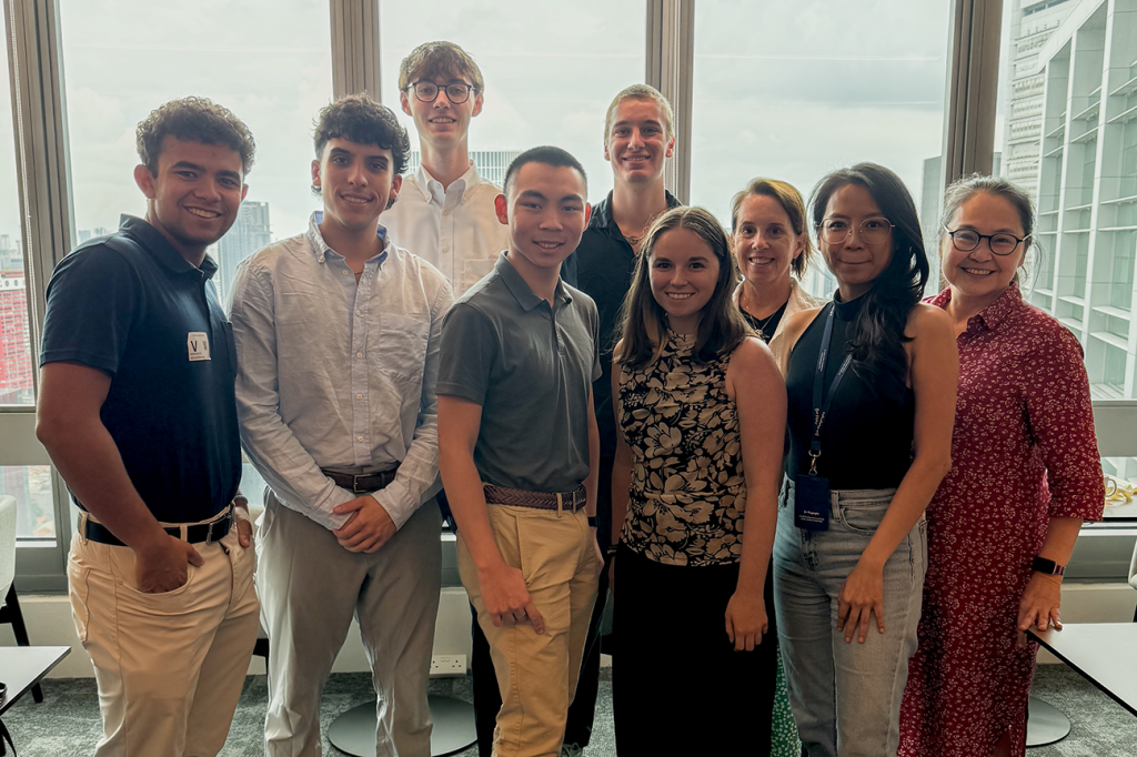 Elon students and faculty pose together during a professional visit in Singapore.