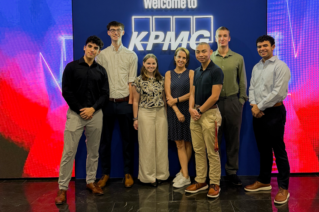 Elon students and faculty pose during a visit to KPMG in Singapore.
