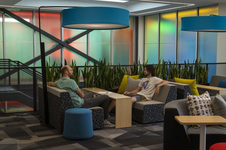 Assistant Professor Will Pluer and Bruce Vagt meet in an IQ lounge