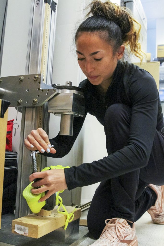 Madison George '23 tests an athletic shoe for her Lumen Prize research