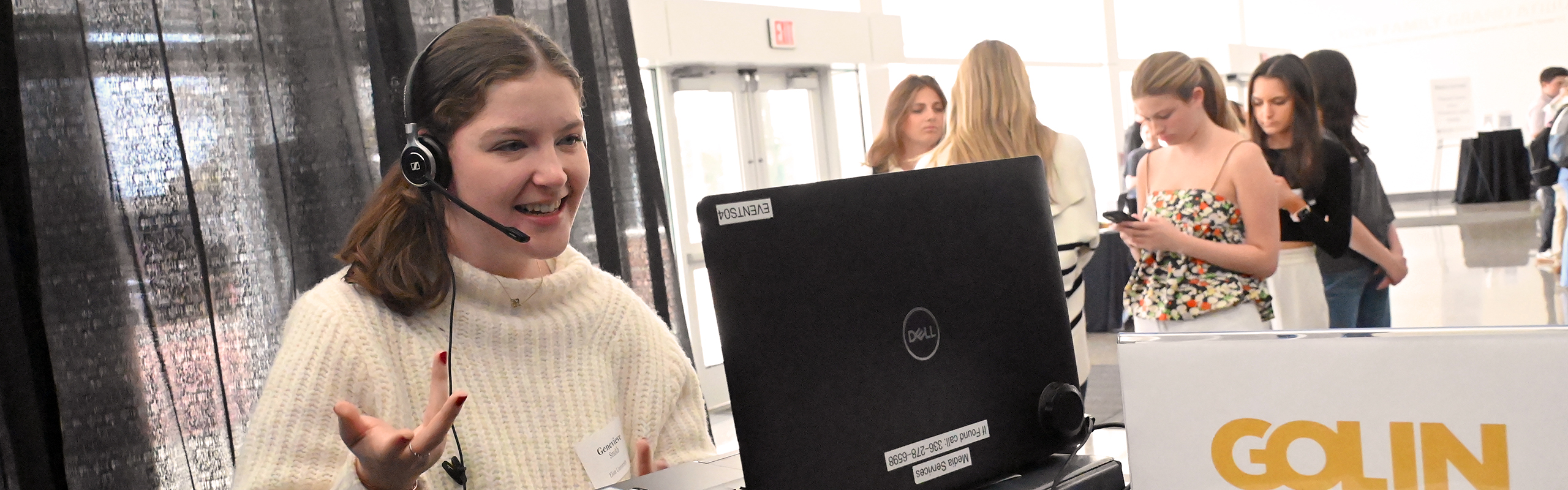 A strategic communications major interested in public relations jobs speaks virtually with an employer at an Elon University career fair and job expo.