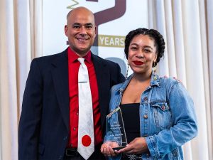 Dean Kenn Gaither stands with Asha Michelle Wilson ’13 