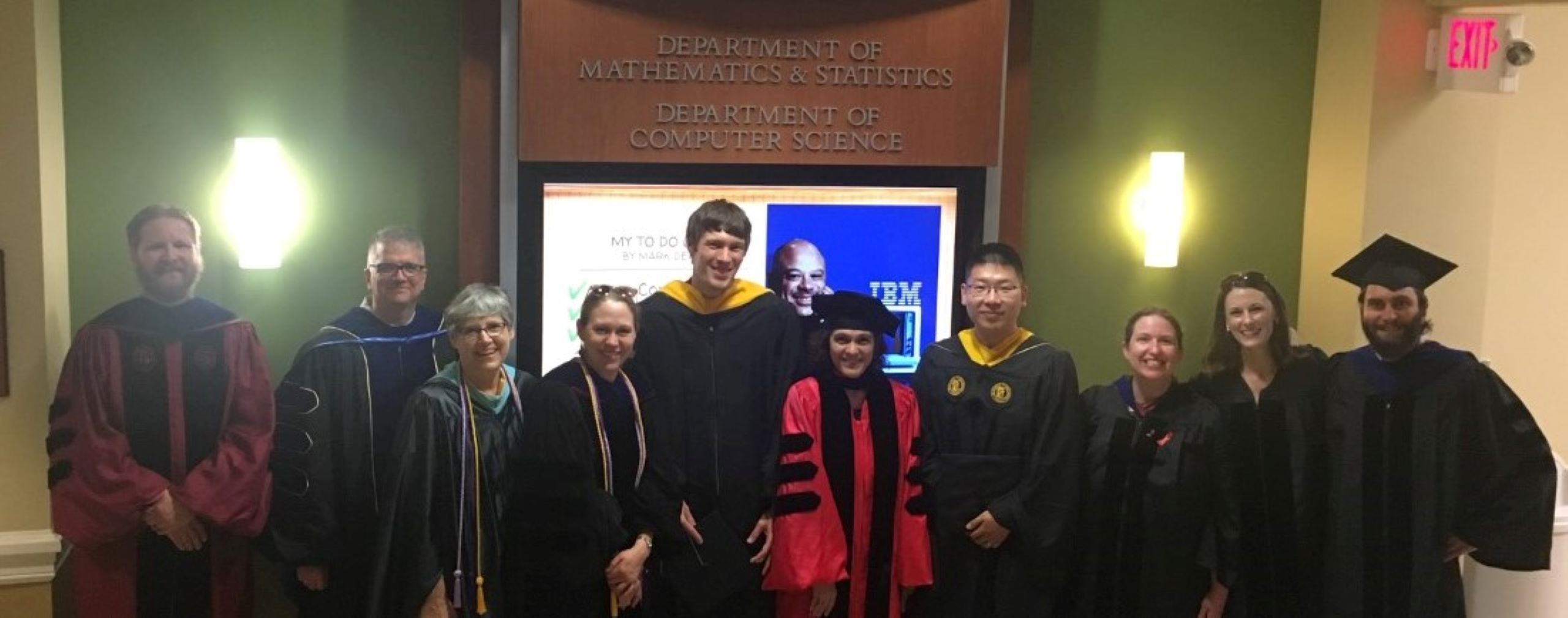 Math and statistics faculty wearing robes for graduation.