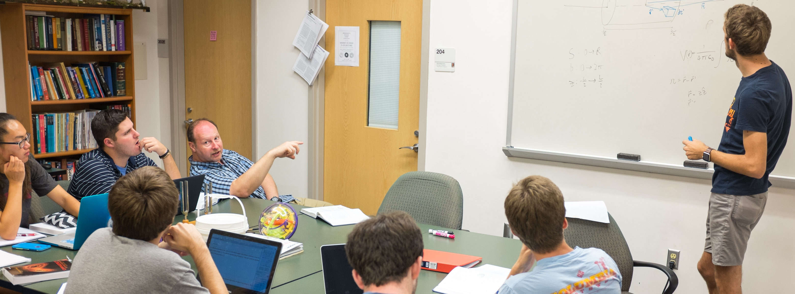 Associate Professor of Physics Martin Kamela teaches physics in a classroom.