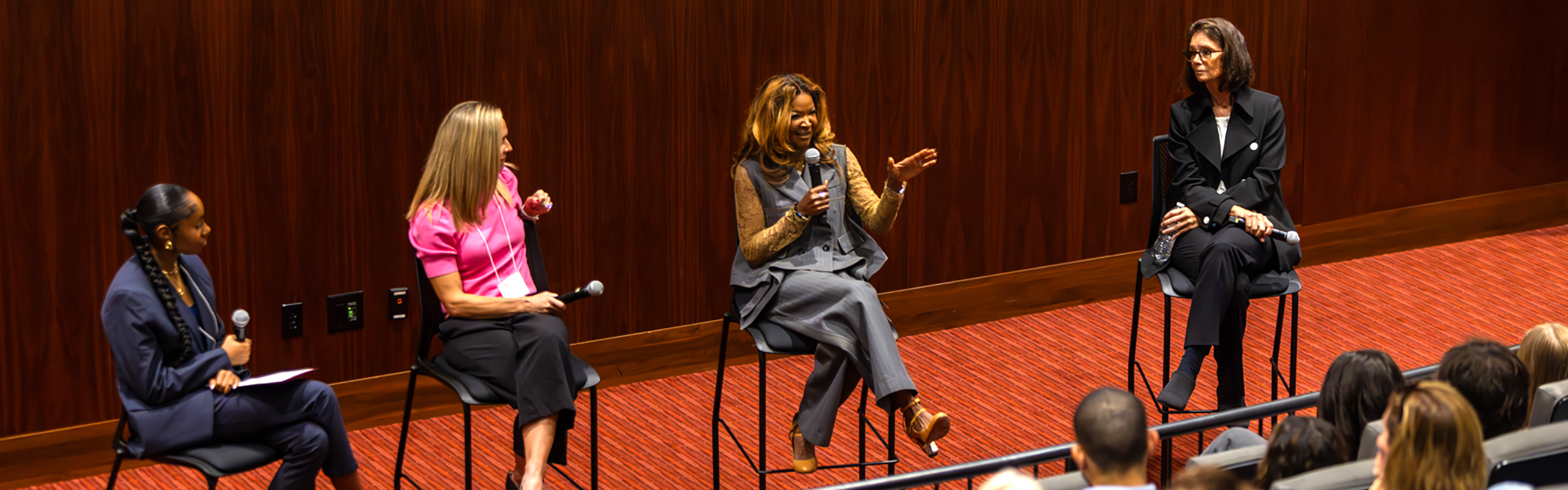 Tamika Tremaglio P’25 (with microphone),