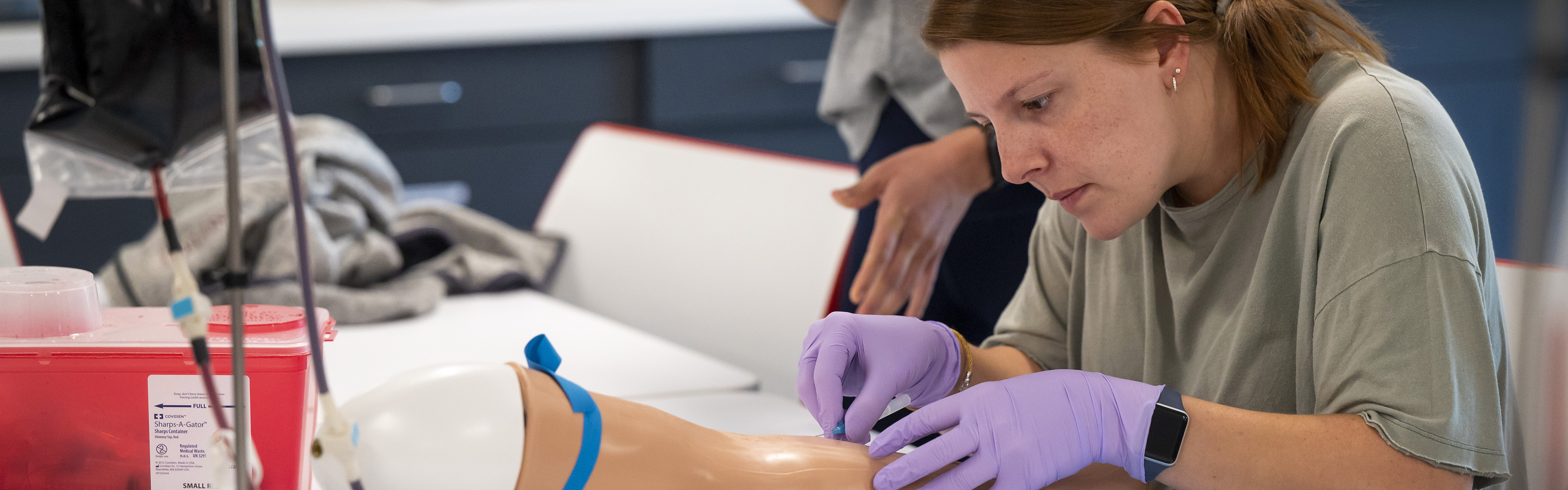 Physician Assistant student Bekah Hudson practices intravenous activities.