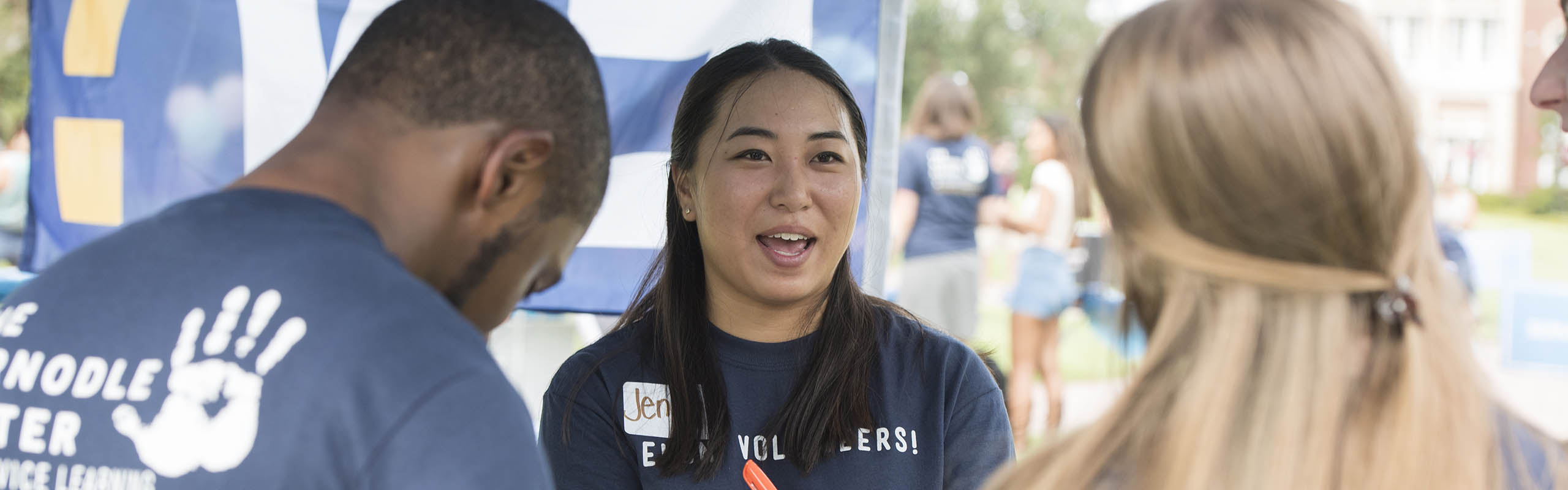 Human service studies major Jenny Fukunaga '17, the Executive Director of Leadership and Development for Elon Volunteers, manages the students working for Elon Volunteers at the Org Fair.
