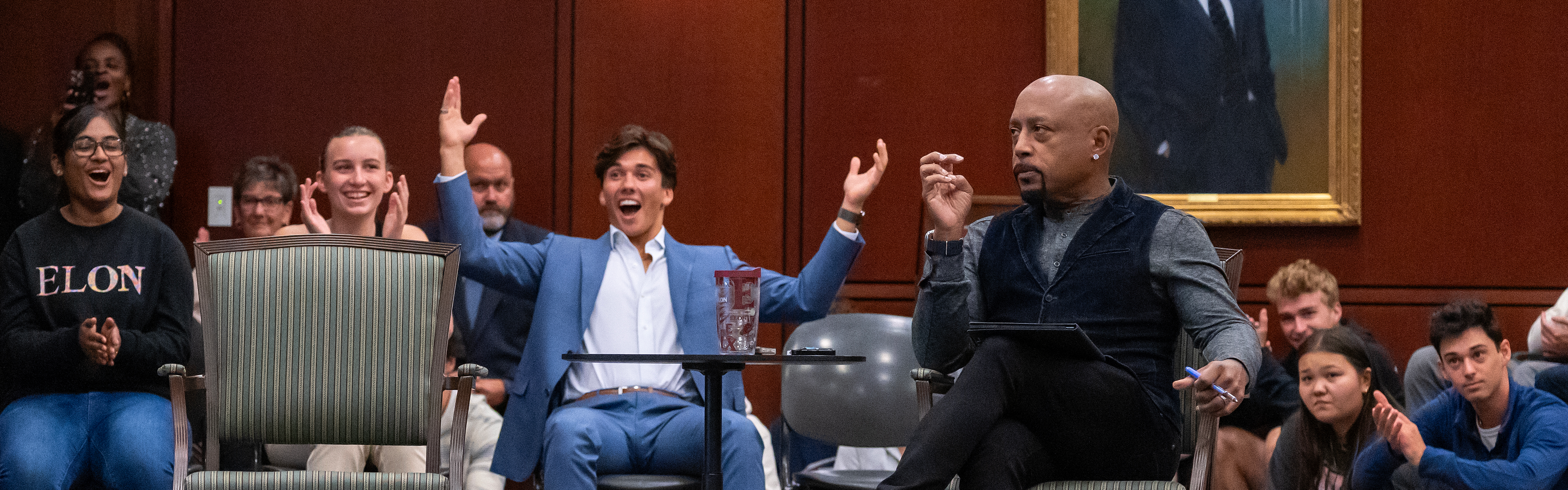 Students at the best business college pitching to Shark Tank's Daymond Johns