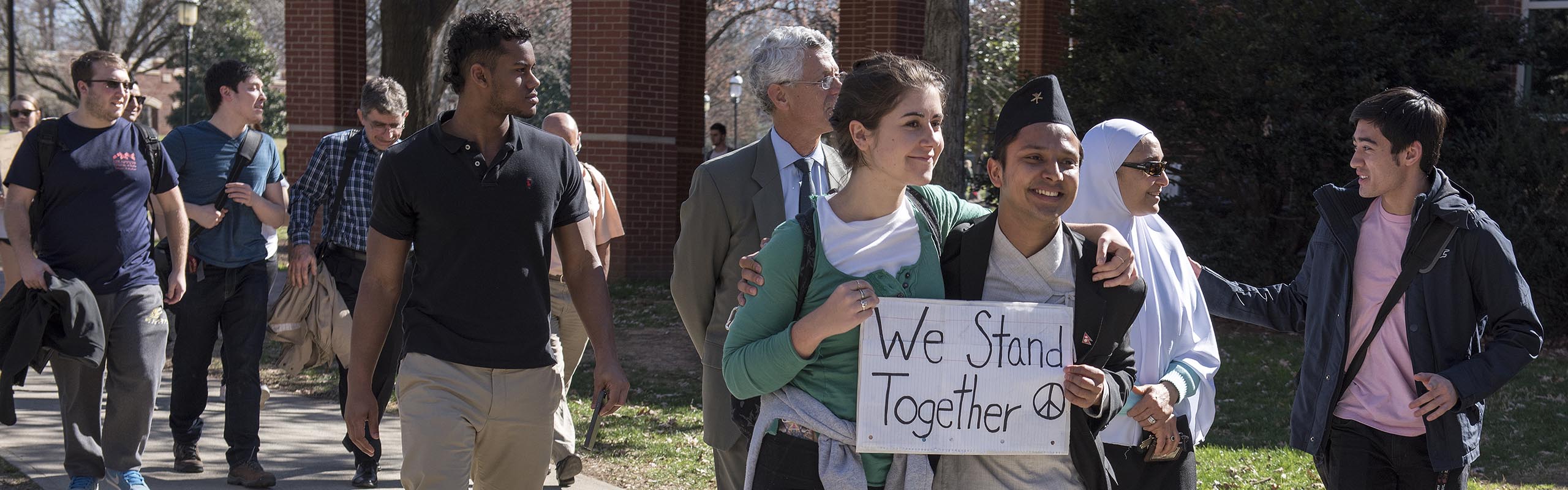More than 100 students, faculty and staff gathered at Elon’s Speakers' Corner on Young Commons to share their concerns and hold a march about the president’s recent Executive Order regarding immigration.