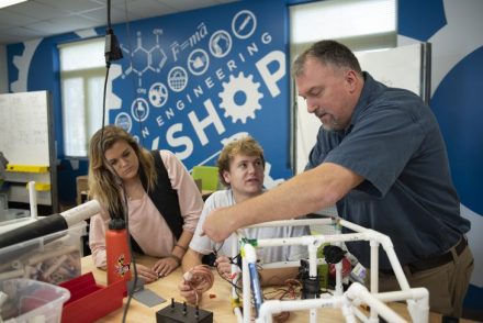 Associate Professor of Engineering Scott Wolter helps undergraduate students build remotely operated underwater vehicles in Hampl's Engineering Shop.