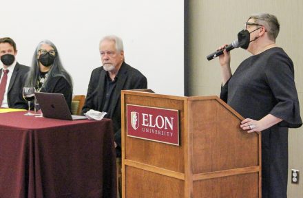 Professor of Religious Studies Lynn Huber welcomes current and former Elon faculty panelists to a reception marking the Center for the Study of Religion, Culture and Society's first 10 years on Feb. 21, 2022.