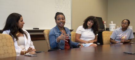 Left to right, Nazaneen Shokri ’24, Mia Wilson ’22, Deena Elrefai ’22, and Queen Assata Stephens ’22 describe the community and support they've felt as members of the H.E.R. Lab, Monday, April 11, 2022 at Elon University. (Rob Brown photo)