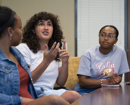 Left to right, Mia Wilson ’22, Deena Elrefai ’22, and Queen Assata Stephens ’22 speak about their experiences with the H.E.R. Lab, Monday, April 11, 2022 at Elon University. (Rob Brown photo)