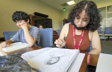 Elon Freedom Scholars Michelle Barillas, right, and Carlos Rivas Enriquez study and work on creative projects in Global Commons. 