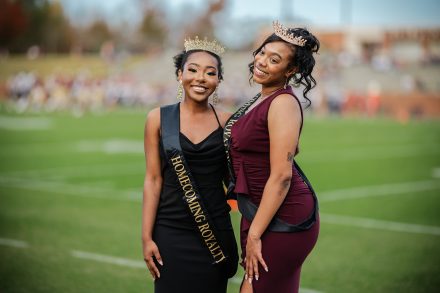 Elon 2022 Homecoming Royalty court posing together during the Homecoming football game. 