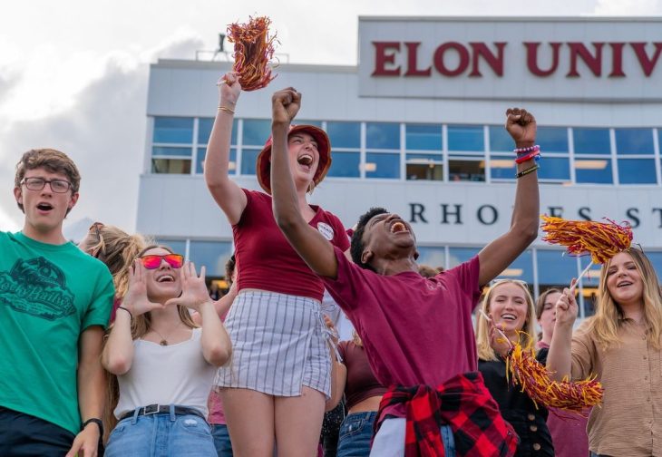 Elon fans cheering in the stands at Rhoades Stadium