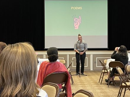 Charity Blackwell, reciting a poem during the Intersect 2022 conference keynote. 