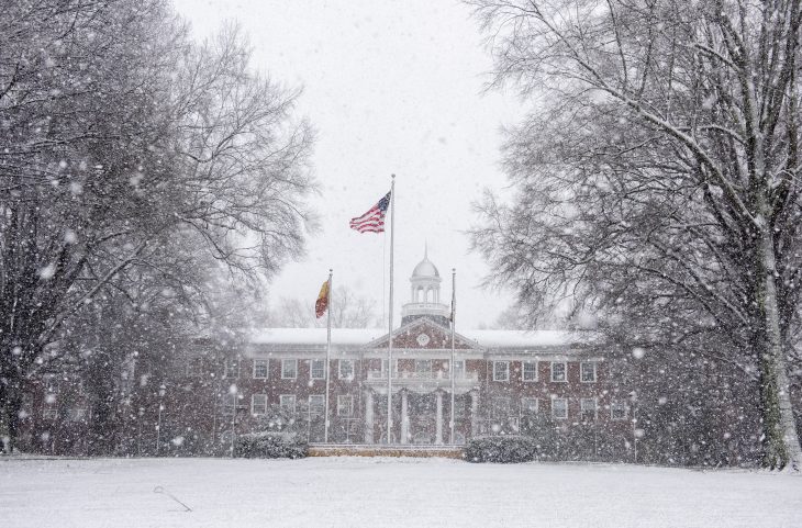 A wet, heavy snow covers the lawn and trees in front of the Alamance Building during a winter storm that hit Elon and much of North Carolina Monday, January 3, 2022.