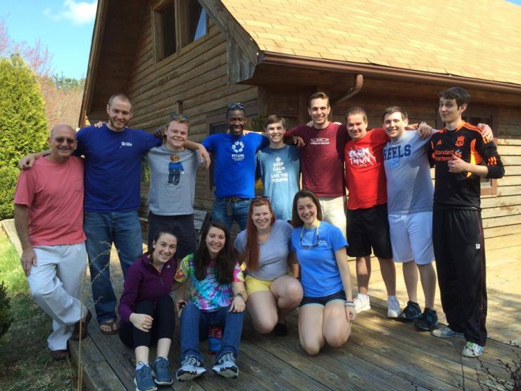 Elisson Adrien '17 with CCM members on retreat