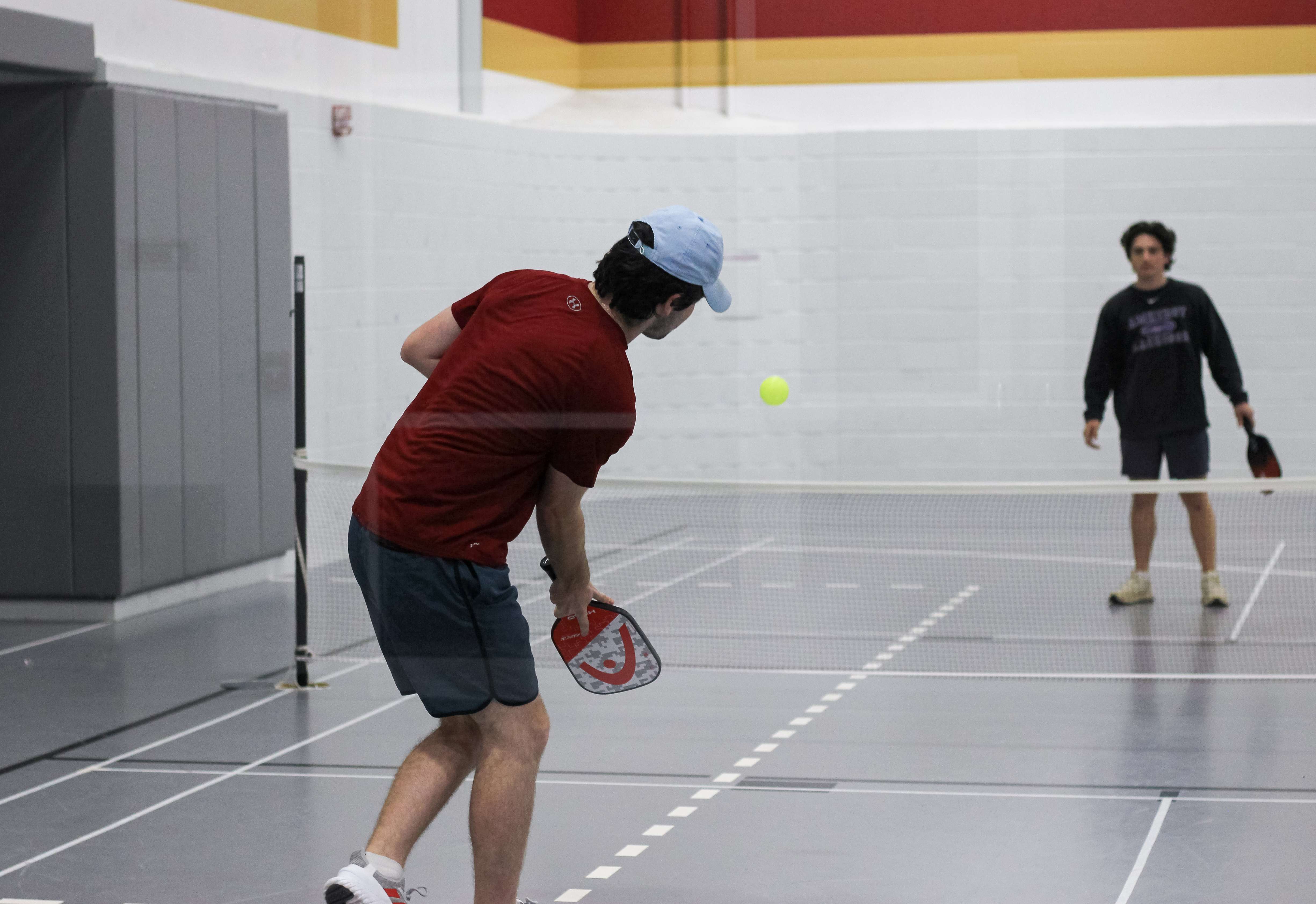 Action shot of two students playing intramural pickleball.