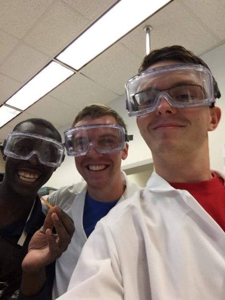Adrien '17 with lab partners at Elon