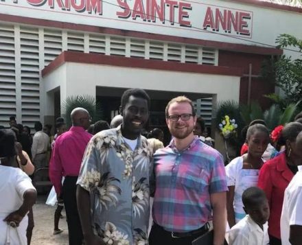 Elisson Adrien '17 and Dr. John McGreevy, PhD '10 photographed together in Haiti