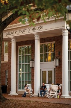 A class meets outdoors in front of LaRose Student Commons at Elon University