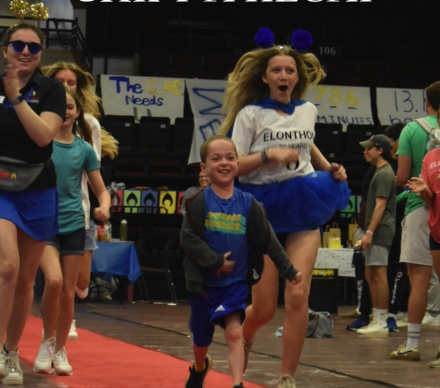 A child races with an Elonthon volunteer at this year's event