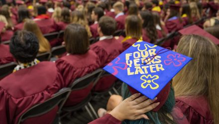 A graduate's cap with the message "Four Years Later" during Commencement 2022