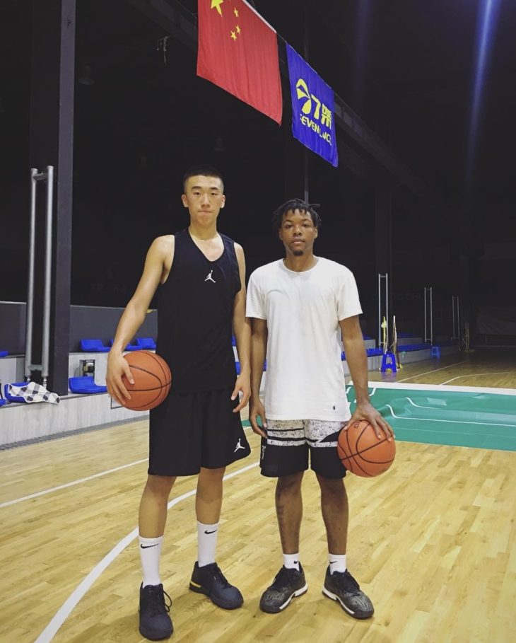 Smith with a player that he coached in China.