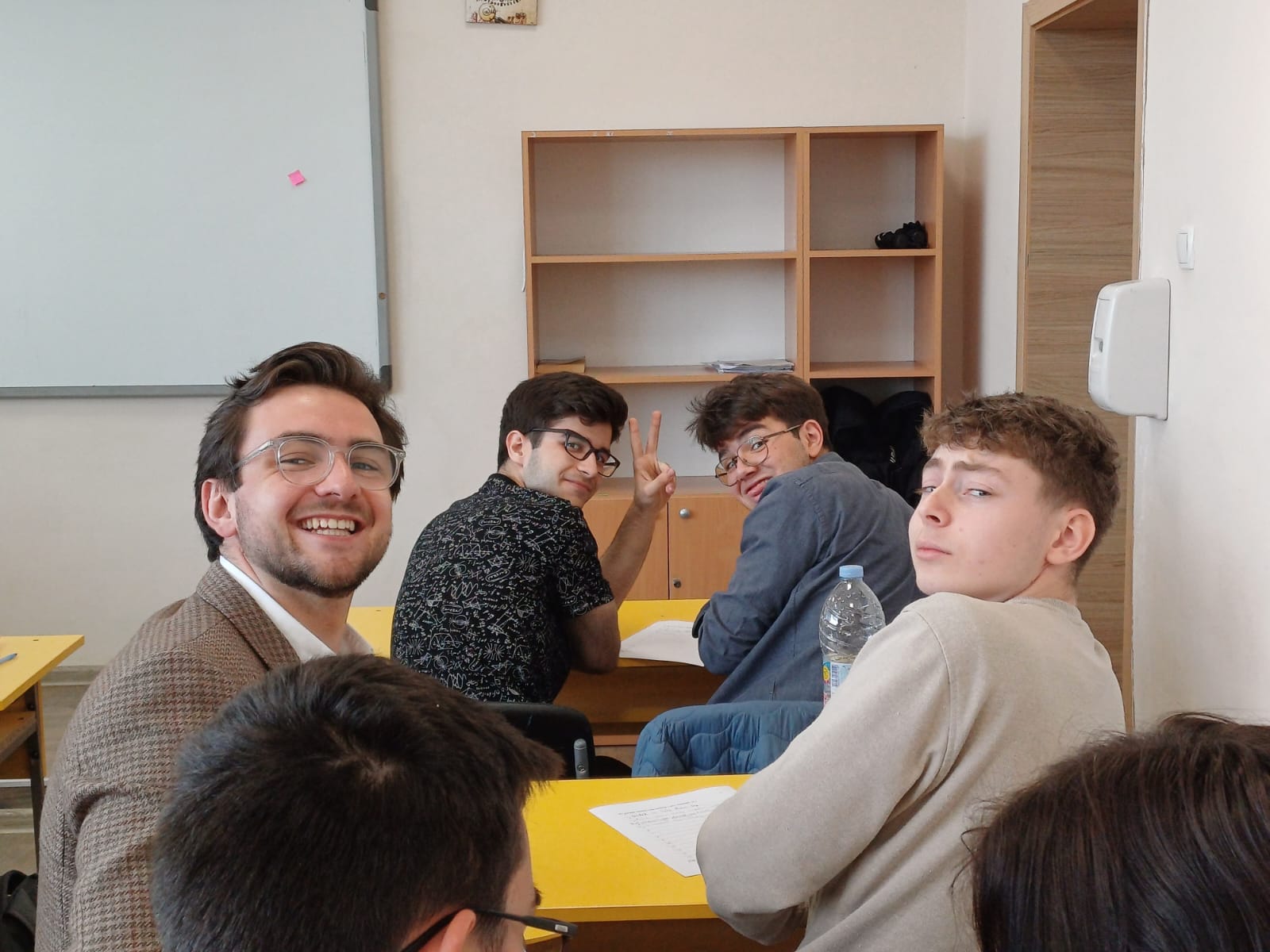 Corby (left) working one-on-one with students through his Fulbright teaching position.