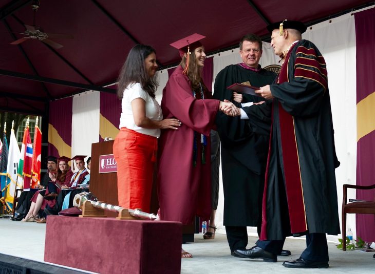 Avery'16 accepts her diploma from President Lambert.