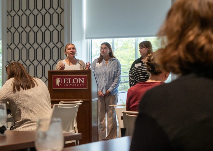 Maddie Johnson '24, at podium, discusses her Campus Alamance experience during an Sept. 27 event for students and community partners.