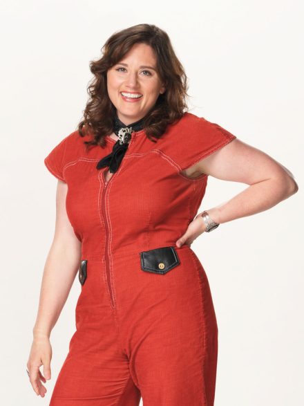 Alexa Wildish in a red suit for a promo portrait for The Voice