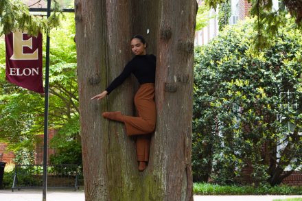 Woman in posing in a tree.