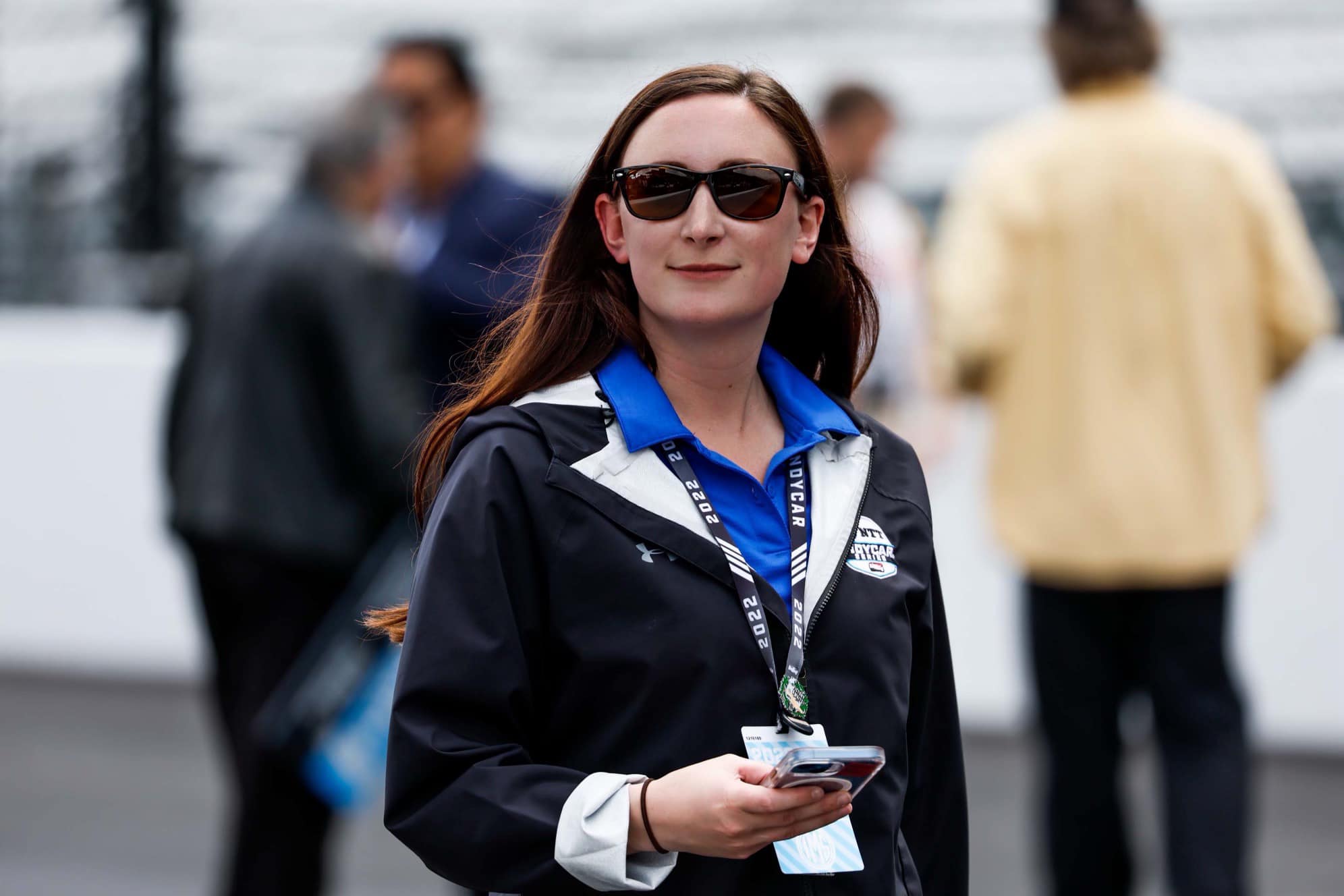 Alivia Mattioli-Hodge smiles in sunglasses at the Indianapolis Motor Speedway