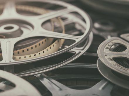A photo of film reels laying on top of one another.