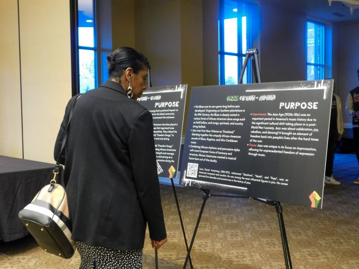 Attendee viewing posters at the Black History Month kickoff event held on Thursday, February 1, 2024. 