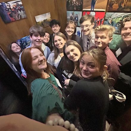 A photo of Elon students crowding into an elevator in Diamond View Studios.