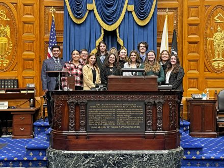 Elon University students stand in the Massachusetts State House.