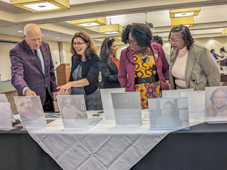 From left, Elon University President Emeritus Leo Lambert, Provost Rebecca Kohn, Associate Professor of Education Cherrel Miller Dyce and Senior Lecturer in Human Service Studies Sandra Reid view an archival display at the African and African-American Studies Minor 30th anniversary gala. The display was curated from Belk Library archives by Shaunta Alvarez, digital collections and systems librarian.