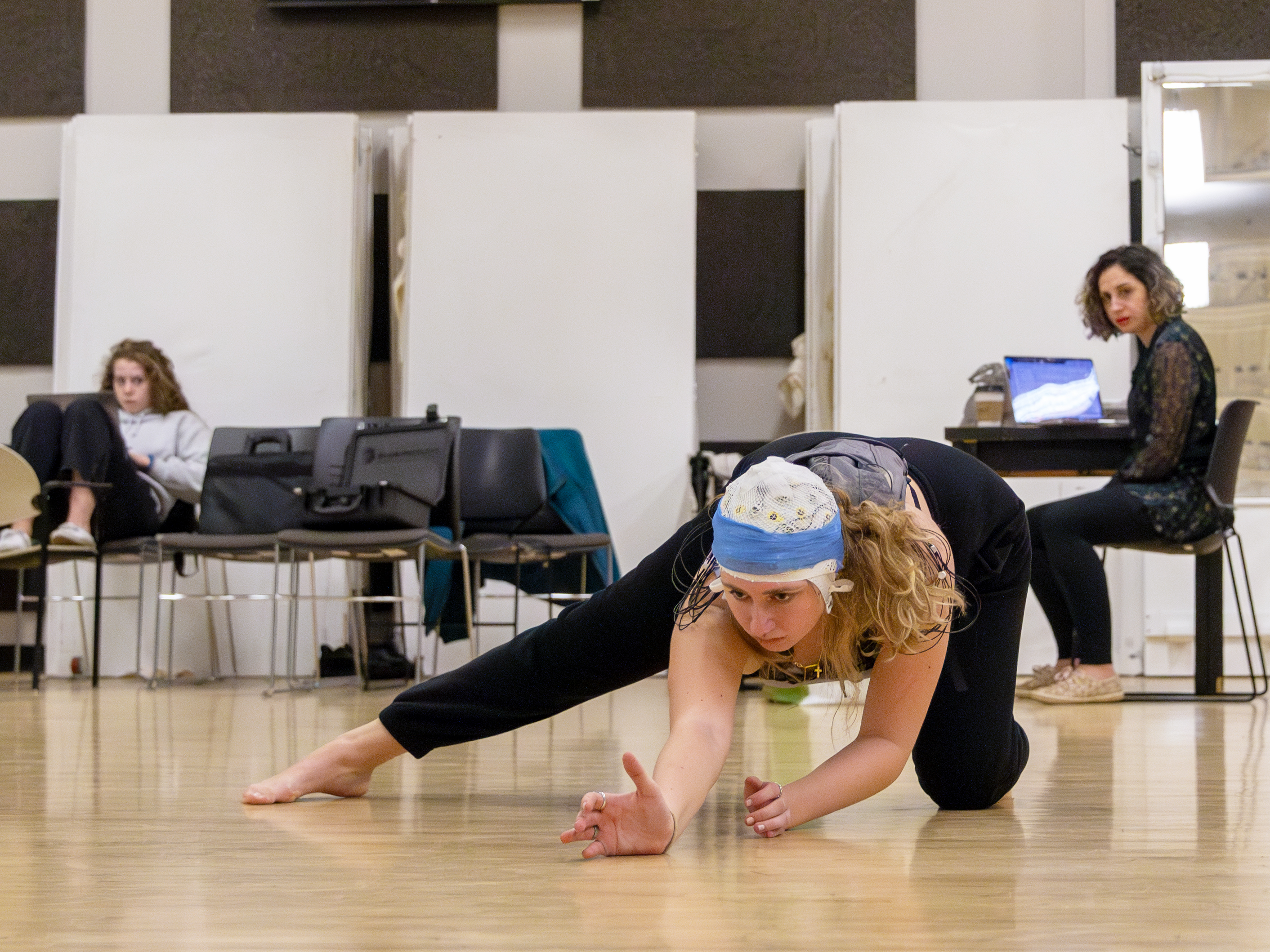 Meredith Peck performs a dance routine wearing an EEG cap