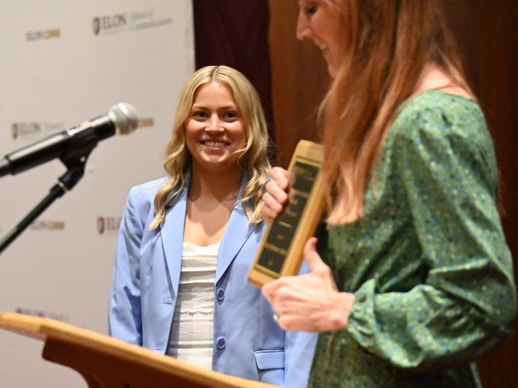 Katy Boehmer-Abbott, a sport management major, smiles while being honored at the School of Communications awards ceremony