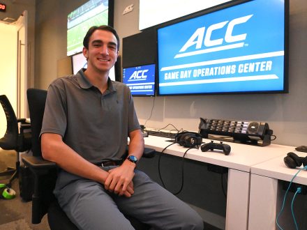 Anthony Bamford sits at an ACC computer in the conference's Charlotte office.