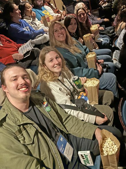 Elondocs students sit in movie theater in Durham.
