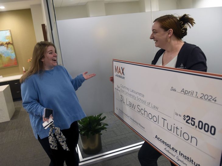 Elon Law student Courtney Latourrette from the Class of 2024 won a $25,000 scholarship from AccessLex Institute when her name was drawn at random from entries of law students who took part in AccessLex's MAX financial literacy and planning program. Morgan Cutright of AccessLex shared news with Latourrette in an April 17, 2024, surprise check presentation attended by Elon University School of Law administrators.
