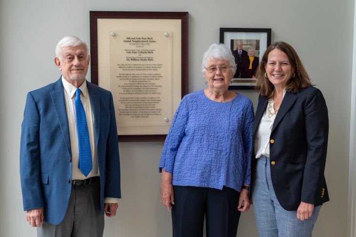 Bill and Lela Faye Rich with President Connie Ledoux Book next to the plaque naming the Global Neighborhood Green in their honor. The couple was honored during a dedication ceremony on May 4, 2024.
