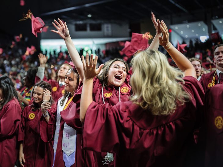 Students cheer after the 2024 Elon commencement ceremony